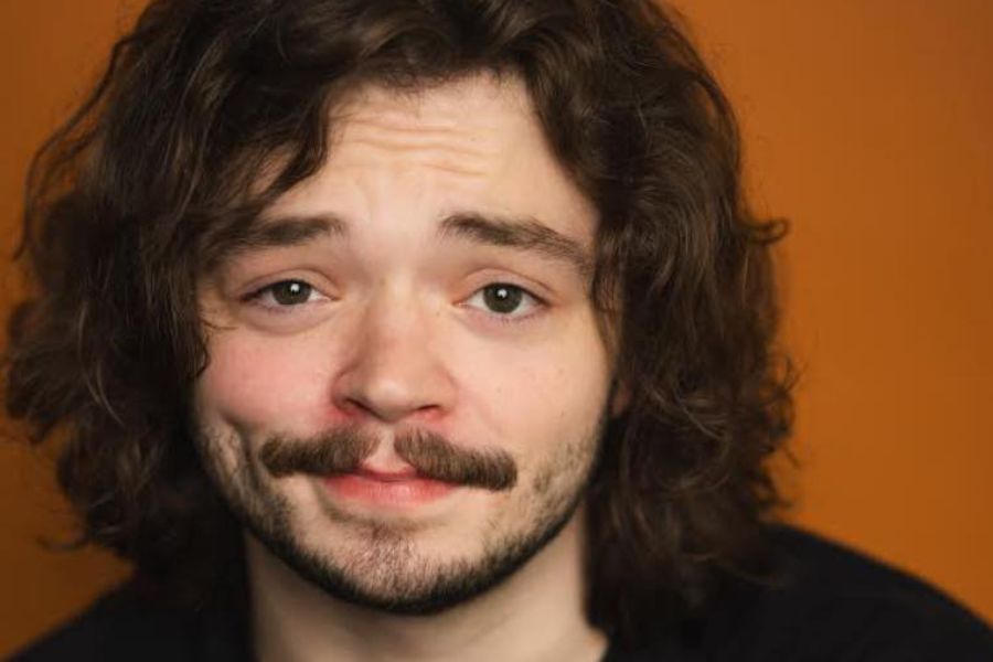 The NSAC team poses for a photo outside, in front of campus buildings and a statue in Spokane. WA